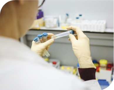 BORDERED_SCIENTIST INSPECTING SAMPLE