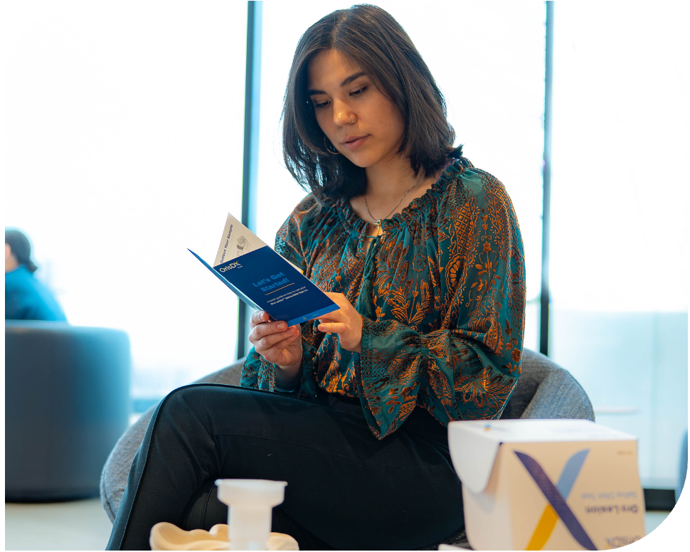 BORDERED_WOMAN READING IFU